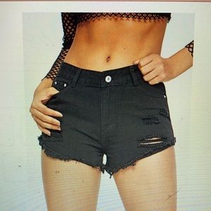 Mid-waist distressed raw cut shorts